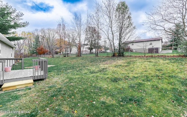 view of yard with a wooden deck