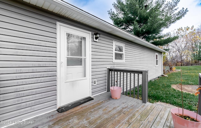 wooden deck with a yard