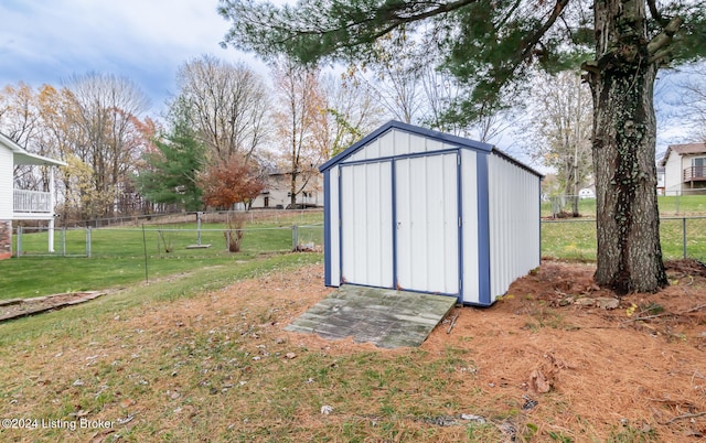 view of outbuilding with a lawn