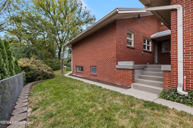 view of home's exterior with a lawn