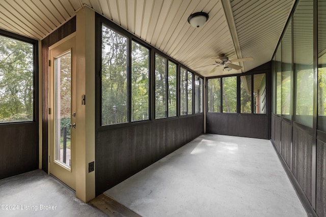 unfurnished sunroom featuring ceiling fan and lofted ceiling