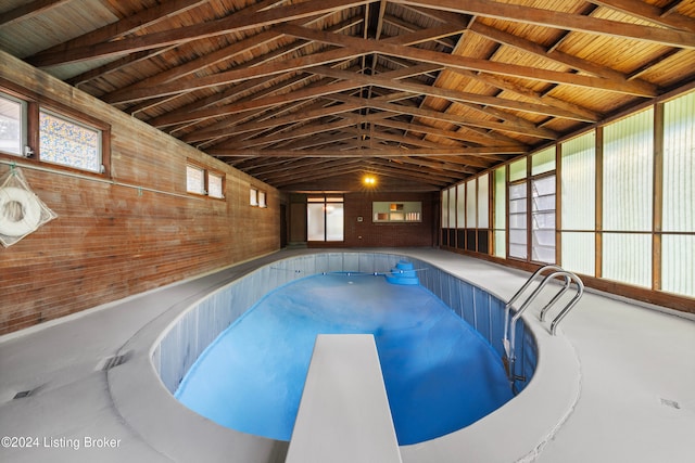 view of pool featuring a diving board