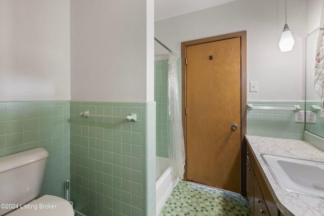 full bathroom featuring shower / bath combo, toilet, tile walls, and vanity