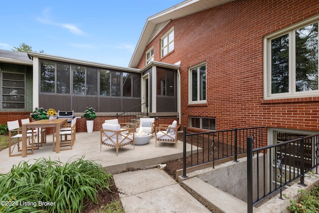 view of patio featuring an outdoor living space and a sunroom