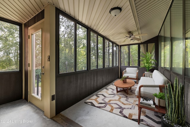 sunroom / solarium with ceiling fan and lofted ceiling