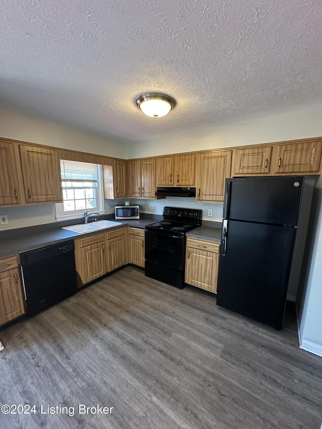 kitchen with a textured ceiling, sink, dark hardwood / wood-style floors, and black appliances