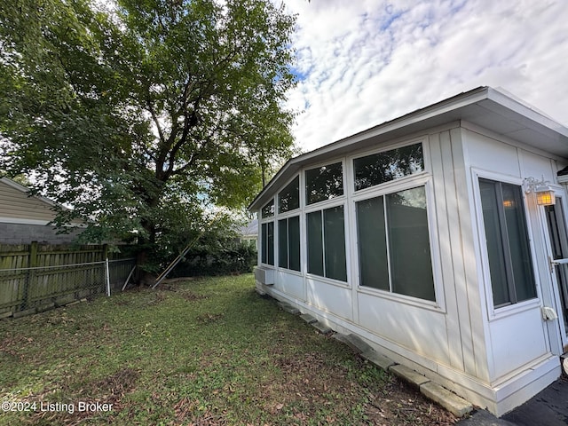 view of home's exterior with a lawn