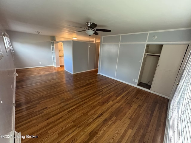 interior space featuring dark hardwood / wood-style flooring and ceiling fan