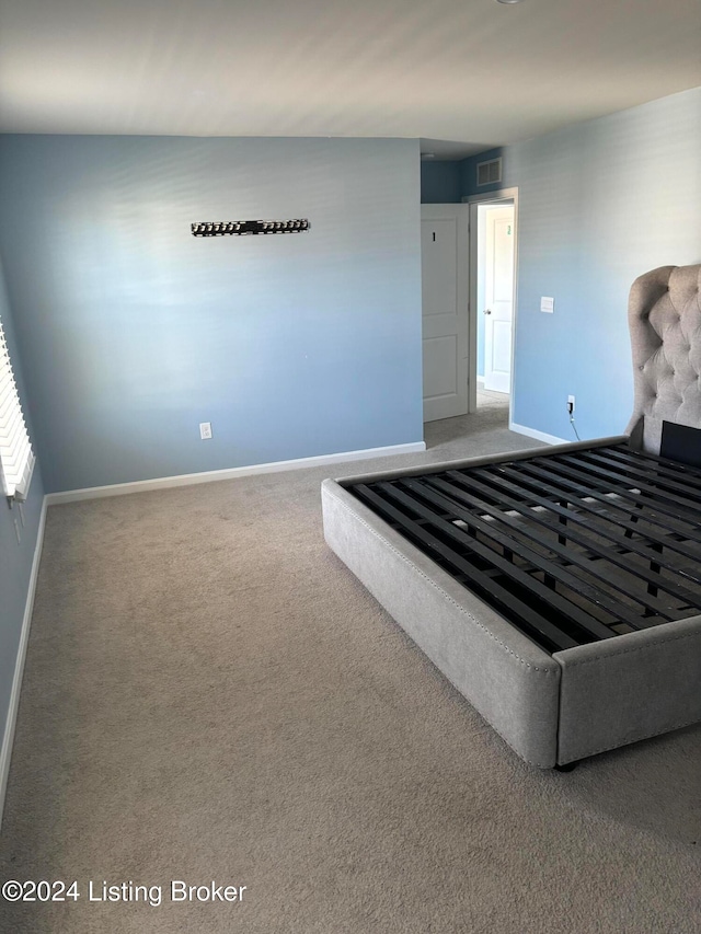 unfurnished bedroom with carpet floors