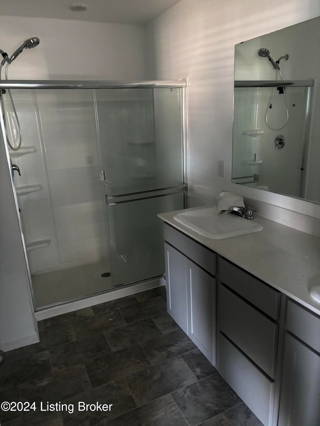 bathroom with vanity and an enclosed shower