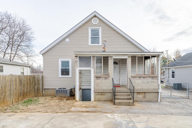 bungalow-style house with cooling unit