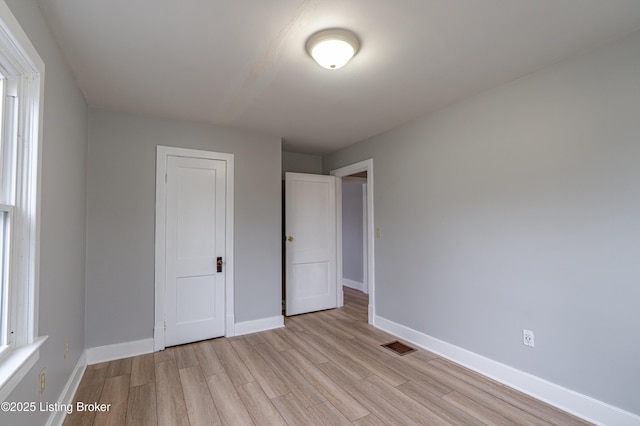 unfurnished bedroom with light hardwood / wood-style flooring