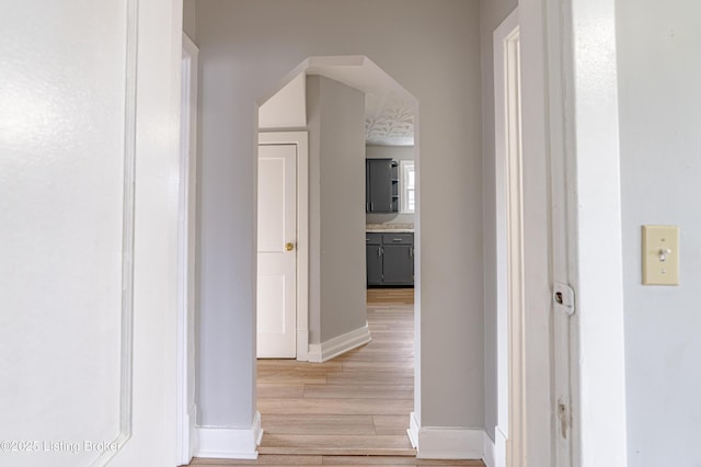 hall with light hardwood / wood-style floors