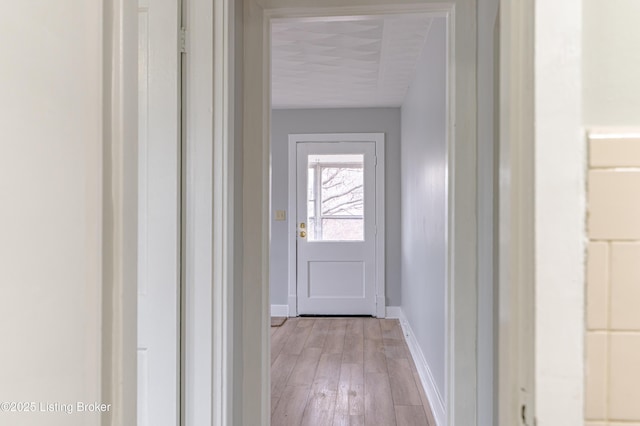 doorway with light hardwood / wood-style floors