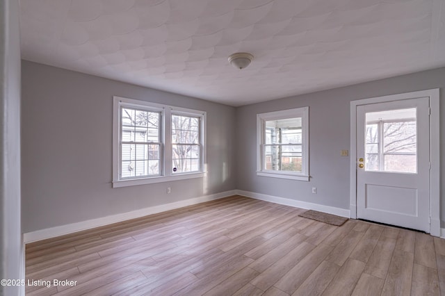 foyer with light wood-type flooring