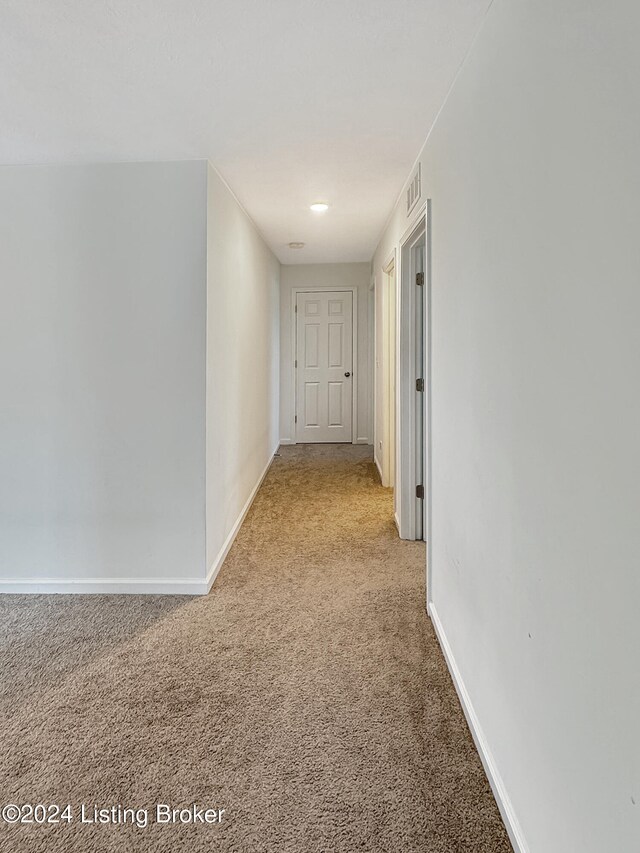 corridor with light carpet