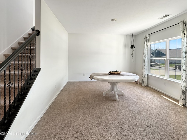 dining space with carpet flooring