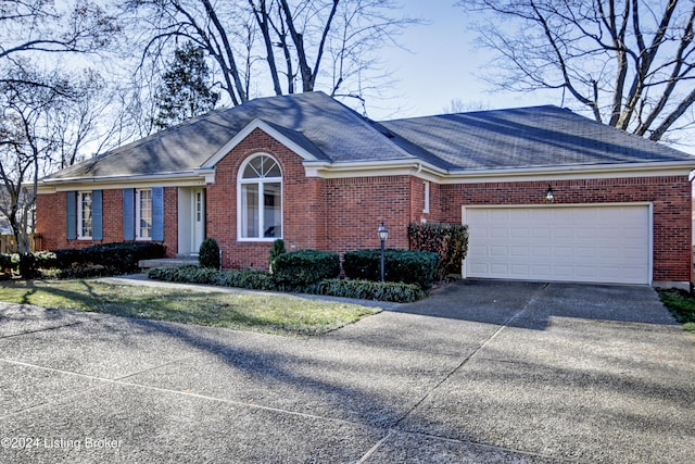 ranch-style house featuring a garage