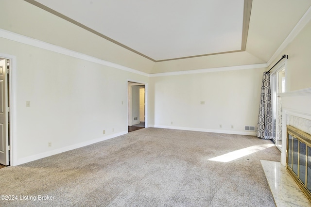 unfurnished living room with a fireplace, light carpet, and crown molding