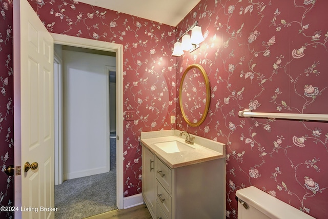 bathroom with vanity and toilet