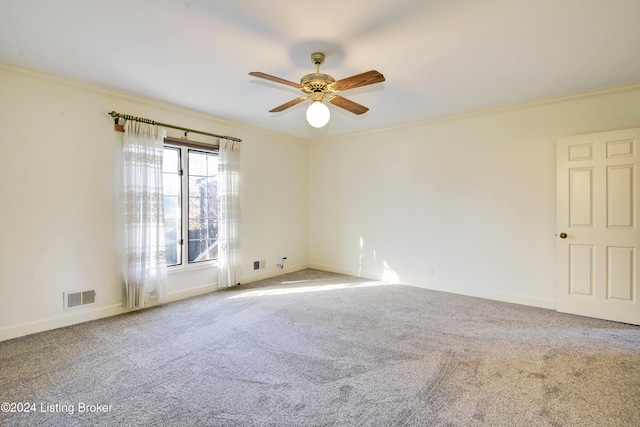 unfurnished room with carpet flooring, ceiling fan, and ornamental molding