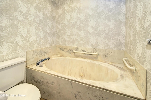 bathroom with a relaxing tiled tub and toilet