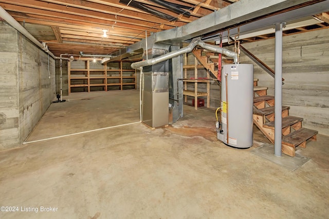 basement featuring heating unit and water heater