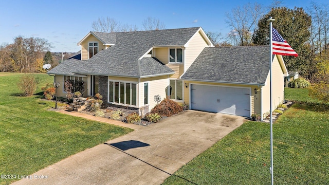 view of front of property featuring a front lawn and a garage