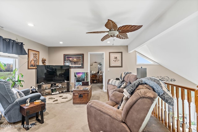 carpeted living room featuring lofted ceiling with beams and ceiling fan