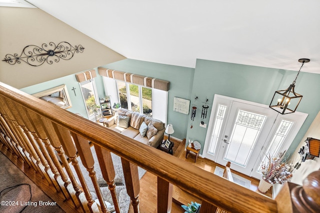 entrance foyer with hardwood / wood-style flooring and a notable chandelier