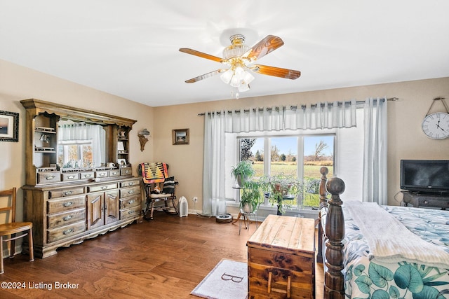 living room featuring dark hardwood / wood-style flooring and ceiling fan