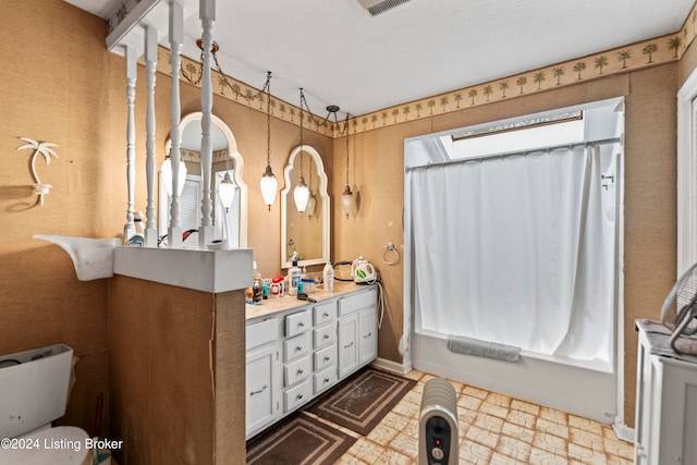 bathroom with shower / bath combo and vanity