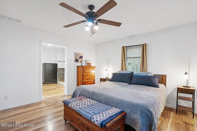 bedroom with ceiling fan and light hardwood / wood-style floors