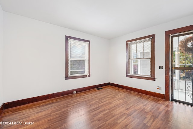 unfurnished room featuring hardwood / wood-style floors