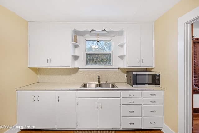 kitchen with sink and white cabinetry