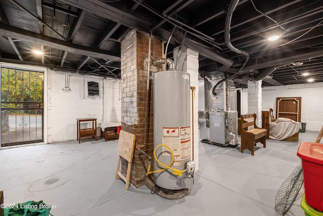 basement featuring heating unit and gas water heater