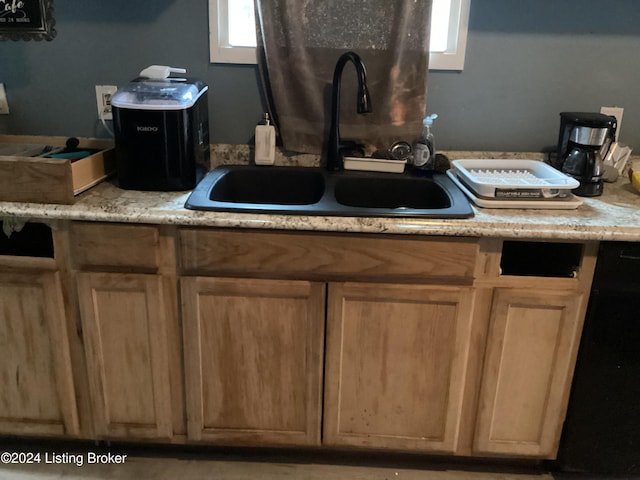 kitchen with sink, black dishwasher, and plenty of natural light