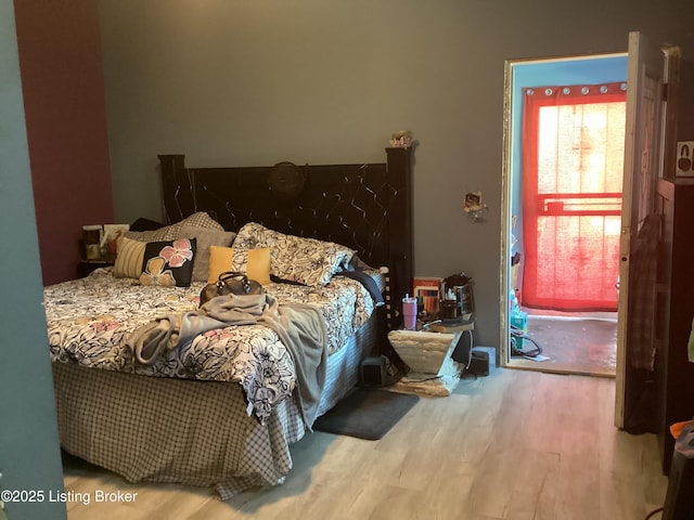 bedroom featuring hardwood / wood-style flooring