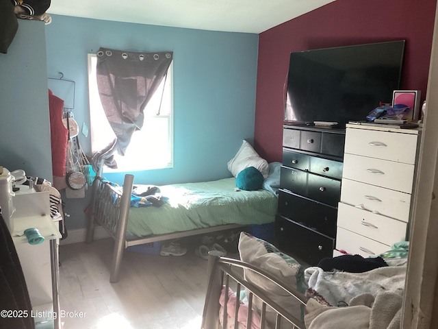 bedroom featuring hardwood / wood-style flooring