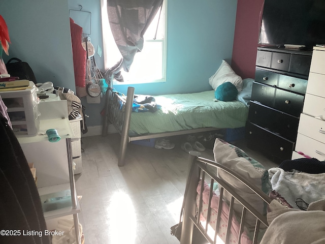 bedroom featuring wood-type flooring