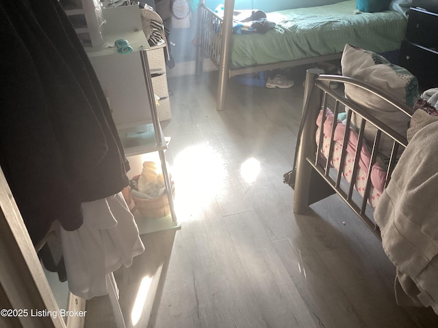 bedroom with hardwood / wood-style floors