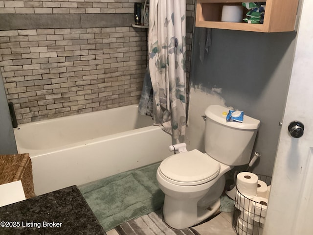 bathroom with toilet, tile patterned flooring, and shower / bath combo