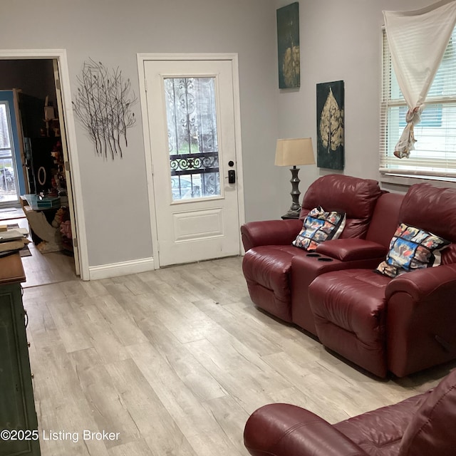 living room with wood finished floors and baseboards