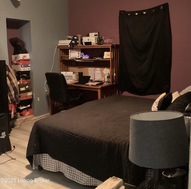 bedroom featuring wood finished floors