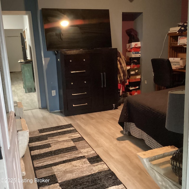 bedroom with light wood-style floors