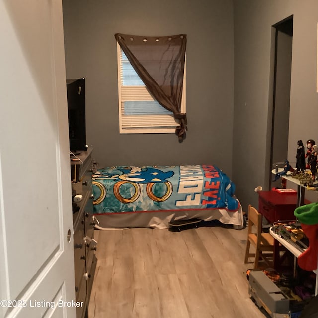 bedroom with wood finished floors