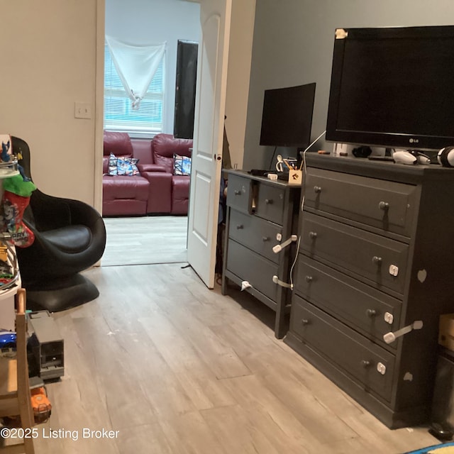 bedroom featuring light wood-style flooring