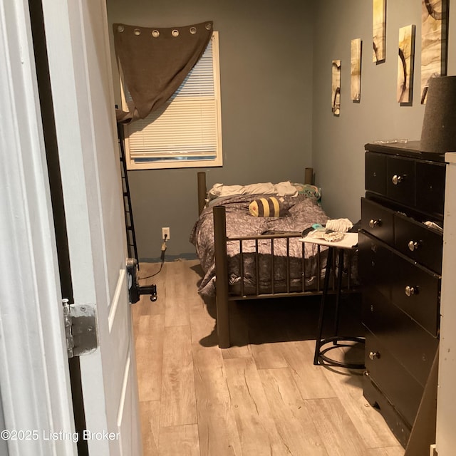 bedroom with wood finished floors
