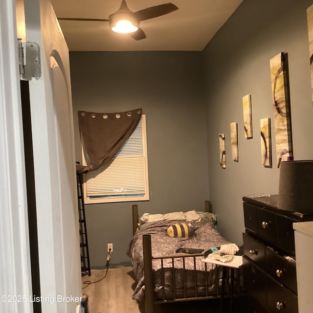 bedroom with ceiling fan and wood finished floors