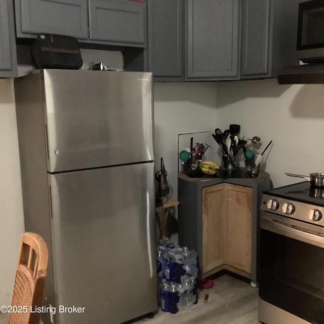 kitchen featuring light wood-type flooring and stainless steel appliances